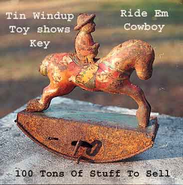 100tos#0286 Toy tin wind-up Ridem cowboy rusty