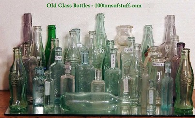 Lots of Old Glass Bottles from Antiques Estate Group photo of some of our Old Glass Bottles from 100tonsofstuff Estate.